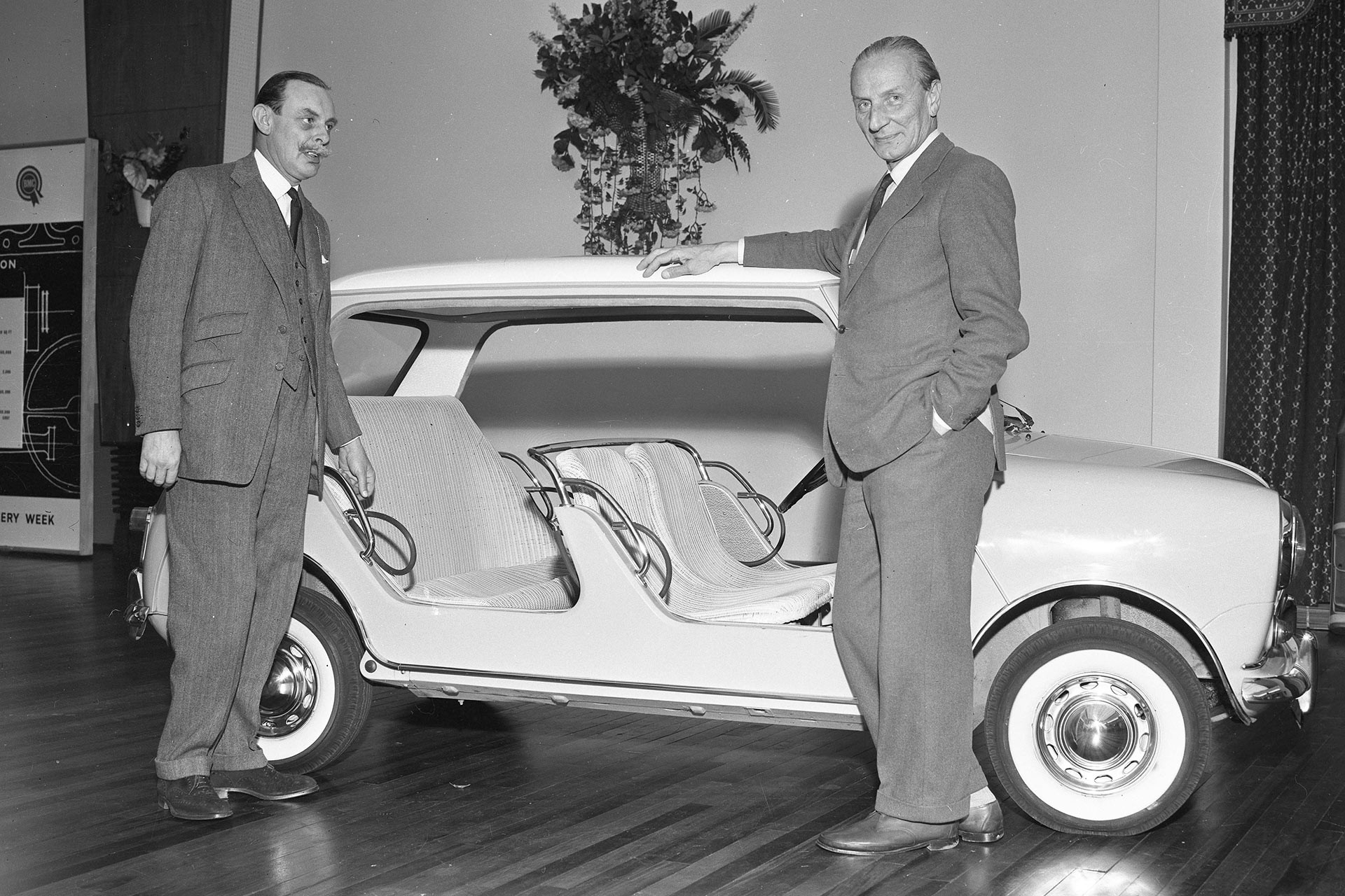 Sir Alec Issigonis showing off the Mini Beach car.